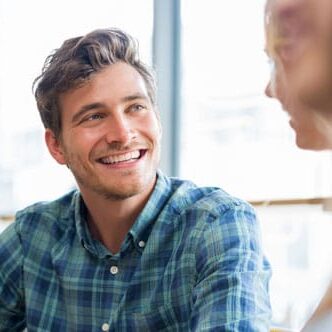 smiling guy in a happy conversation